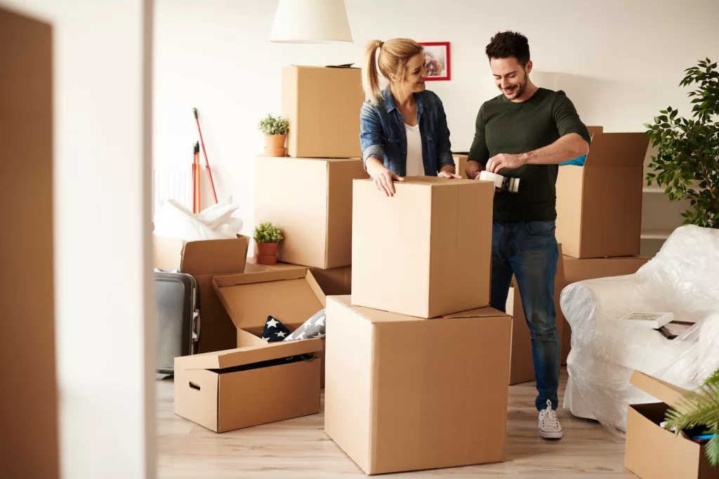 couple packing boxes moving home at Melbourne